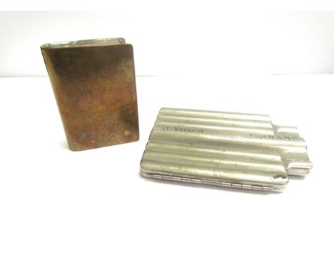 A WWI trench art brass cigarette lighter in the form of a miniature book, the fore edge opening out to reveal lighter mechani