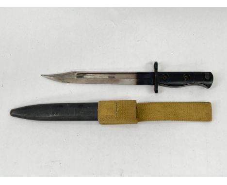 A British military issue L1A3 SLR bayonet, no. 9600257, with scabbard and 1955 dated canvas belt frog 