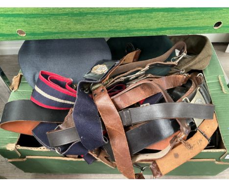 A box of mixed post war headwear including ATS badge visor cap, together with a quantity of belts 