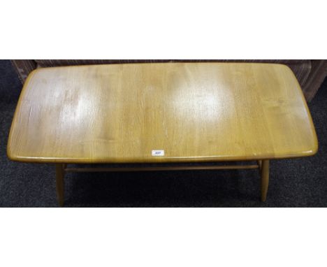 An Ercol elm coffee table with spindled undertier.