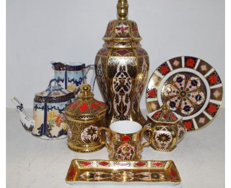 A Royal Crown Derby Old Imari 1128 pattern 21.5cm plate; Derwent Dale Imari pattern - lamp base; a twin handled cup, jar &amp