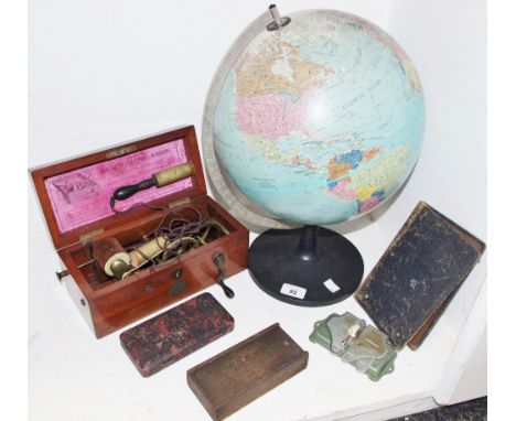 Boxes and objects - a vintage improved magneto electrotherapy machine; globe; calculator,, etc