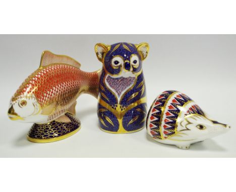 A Royal Crown Derby paperweight Koala Bear, 1st quality, gold stopper; a Hedgehog, 1st quality, ceramic stopper; Golden Carp,