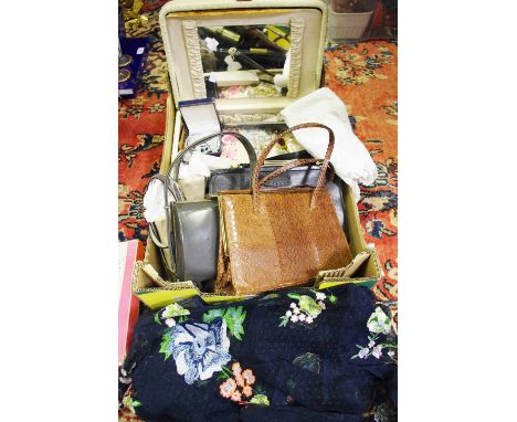 A faux ostrich skin vanity case holding costume jewellery including necklaces, brooches, etc; a silver mounted comb; a Kigu g