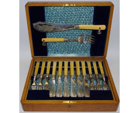 A Victorian EPNS fish set for 12, etched blades swimming fish, light oak case