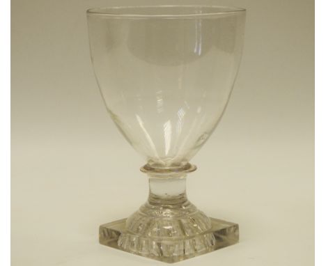 An early 19th century clear glass rummer, with knop, square lemon squeezer base, c.1820