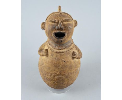 A Ganda spirit vessel Nigeria pottery, with a bulbous body having an incised linear girdle with a pair of arm above, the cres