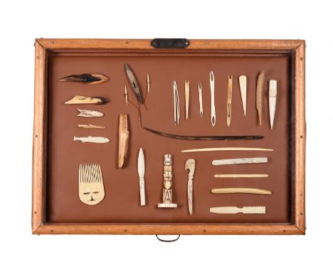 λA collection of Inuit artefacts Arctic and Northwest Coast marine ivory, metal, bone and horn, including three harpoon heads