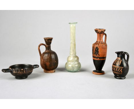 Four Greek miniature vessels circa 4th century BC including a Xenon skyphos, 9.5cm across handles, a Xenon oinoche, 7cm high,