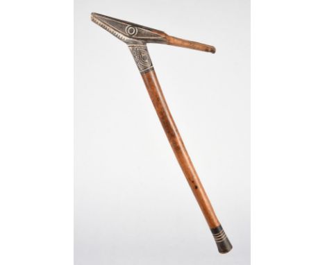 A Massim adze handle Trobriand Islands, Papua New Guinea with carved decoration, black pigment and lime, 54cm long, a Papua N
