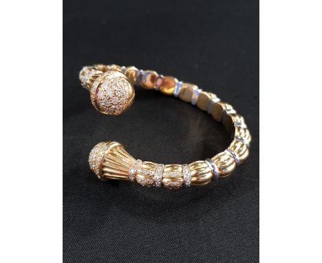 18 CARAT YELLOW GOLD TWIST BANGLE SET WITH 18 CARAT WHITE GOLD BANDS, DIAMOND ENCRUSTED FINIALS WITH COLLARS ALSO DIAMOND ENC