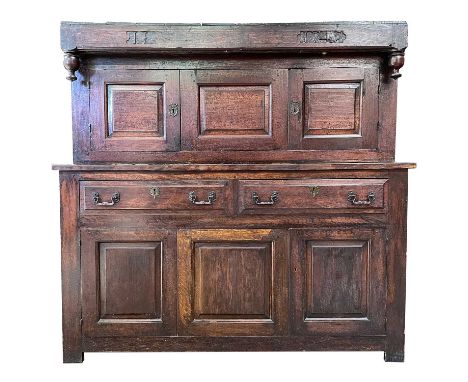 A George II oak court cupboard top, dated 1742.    With three cupboard doors, on a later lower part, circa 1900. with two fri