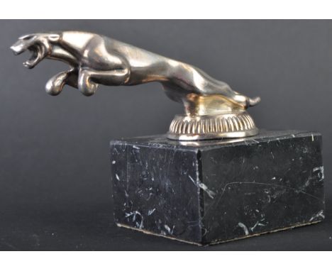 Jaguar Mascot - an original vintage Jaguar Leaper car bonnet mascot of typical form. Mounted atop a squared black marble base