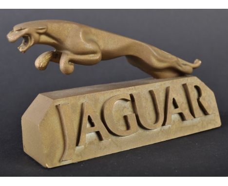 Jaguar - an unusual vintage Jaguar countertop / showroom shop display advertising sign. Resin construction and gold coloured,