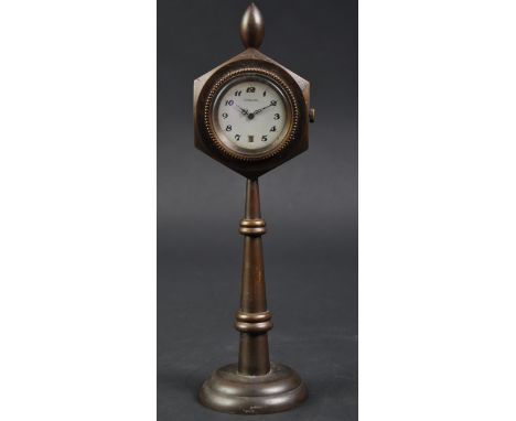 Jaguar - an antique / early to mid 20th century c1930s desk top small clock on stand made by Jaguar. White enamel face with a