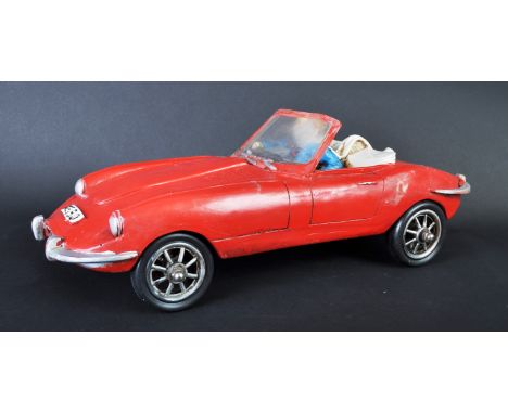 Jaguar - a large 20th century resin model of a classic convertable E Type Jaguar. Red, with driver seated to interior. Well m