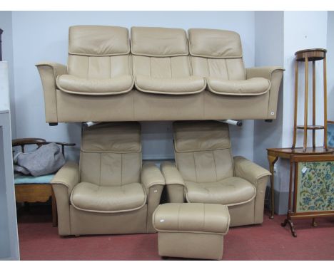 Ekornes (Norway) Four Piece Cream Leather Suite, three seater settee, two arm chairs, pouffe foot stool.