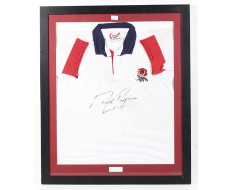A vintage England rugby shirt signed by Mark Regan (b.1972). Framed and glazed, 95.5cm x 80.5cm