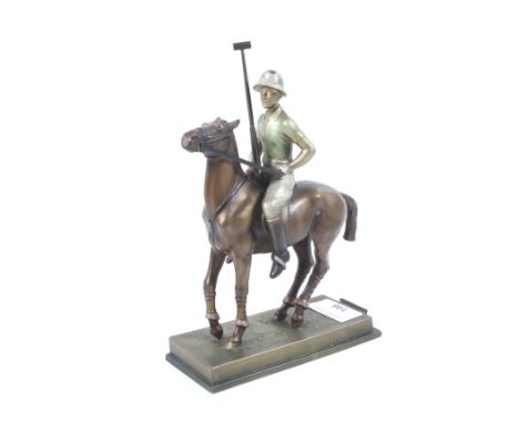 An Austrian Art Deco style novelty table lighter in the form of a polo player on horseback. Metallic patinated spelter, the m