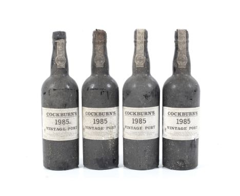 A collection of four bottles of Cockburn's 1985 vintage port. 75cl, 20% vol. 