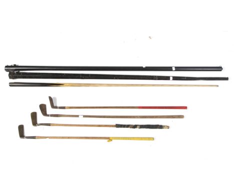 Two vintage snooker cues in cases and four vintage golf clubs. Including hand forged putters, etc.  Condition Report: These c