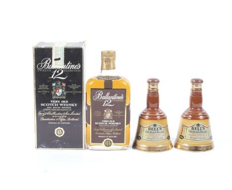 A collection of three bottles of whisky. Comprising one bottle of Ballantines 12 years old blended scotch whisky, boxed, 50cl