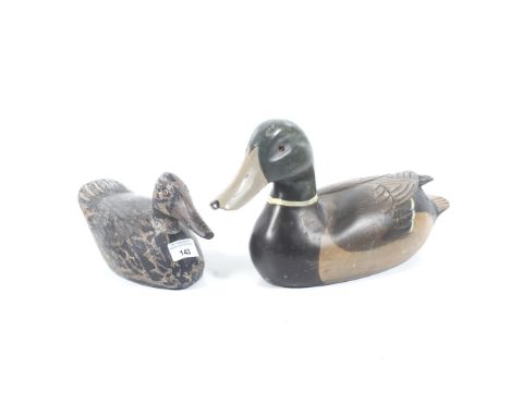 A pair of vintage wooden decoy ducks. One mallard and one female, largest L38cm. 