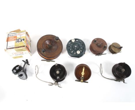A collection of vintage fishing reels. Including examples by Alvey and a 6" wooden Scarborough reel