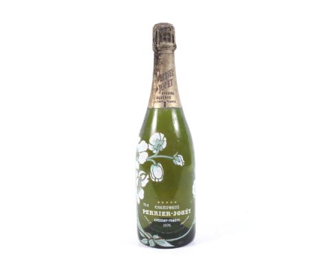 A bottle of Perrier-Jouet champagne 1976. With floral enamel decoration, 75cl, no vol shown. 