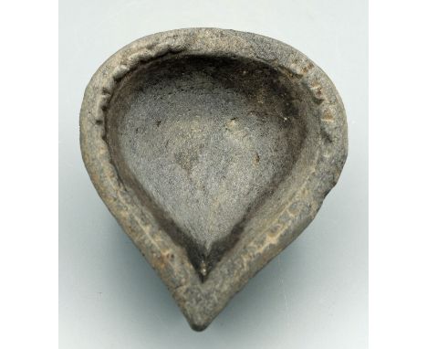 An excellent Gandharan stone oil lamp from the Indus Valley, ca. 3rd - 4th Century AD. This large leaf-form example is 5" lon