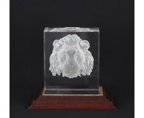 Rare Steuben intaglio cut and partially frosted clear crystal sculpture, "Regal Lion". The solid block of clear crystal cut w