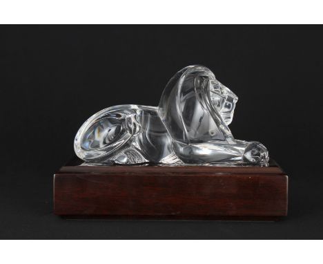 Steuben Lion Sculpture on Stand. Signed near lower portion. Comes with the original fitted box. Width: 8 in. Box Dimensions: 