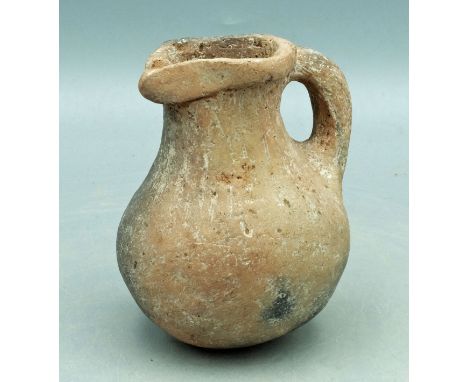 A nice Roman ceramic pitcher/pouring vessel from the Levant, ca.1st - 3rd Century AD. This fine round-bottom example is 3-3/4