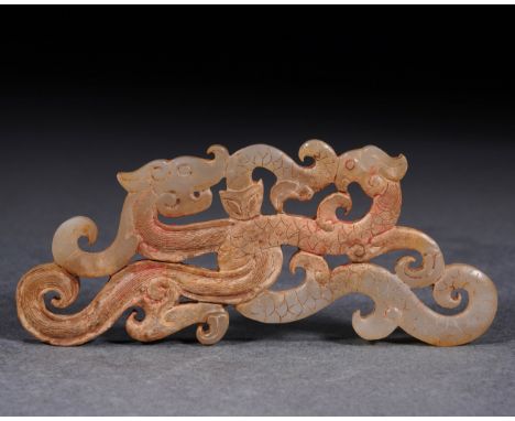 A Chinese Carved Jade Interlocked Dragon Ornament L: 10.2cm; W: 4cm; 28.5g. Han dynasty.