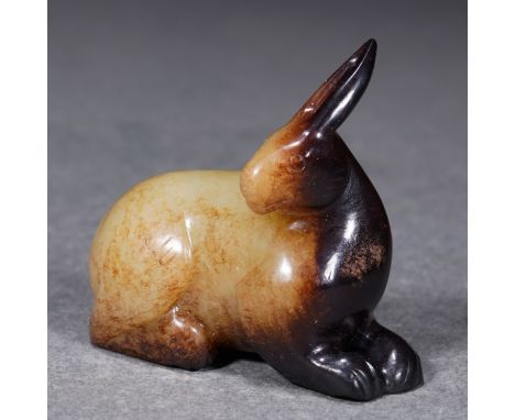 A Chinese Archaistic Jade Carving of Rabbit L: 5cm; H: 4.7cm; 68.5g. Han dynasty.