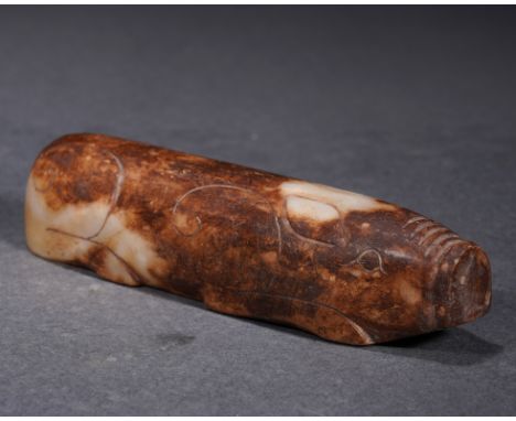 A Chinese Jade Carving of Pig L: 12.5cm; H: 2.5cm; 247g. Han dynasty.