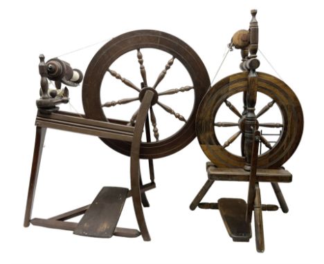 Two vintage beech spinning wheels, largest example H92cm