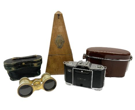 Pair of mother of pearl binoculars, Maelzel metronome and Zeiss Contina camera