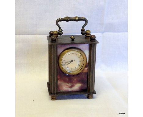 A brass cased miniature carriage clock
