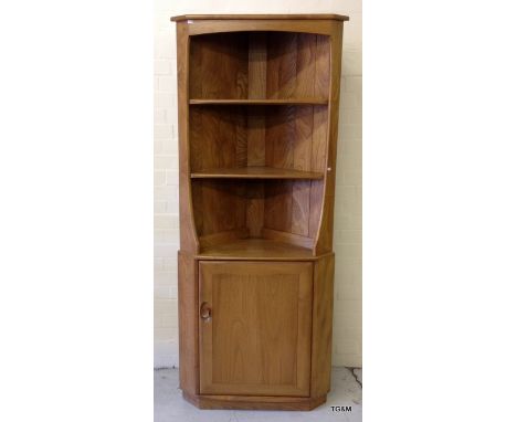 An Ercol Blonde corner cabinet 180 x 75 x 35cm