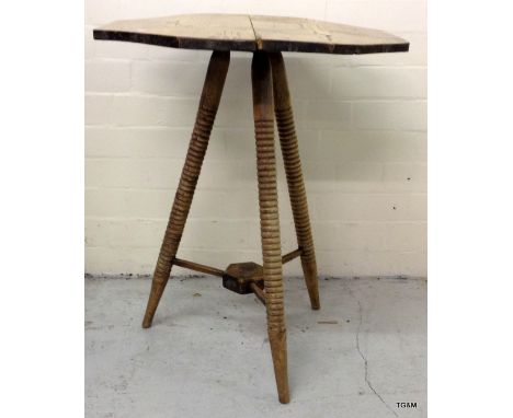 An elm tripod kitchen table on turned legs