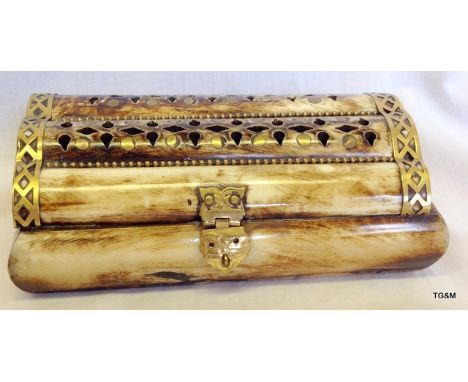 A bone trinket box with brass fittings