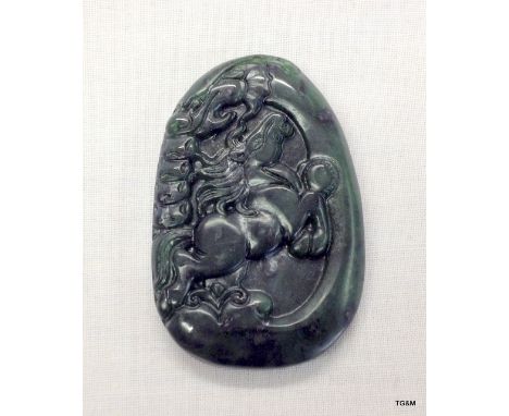 A detailed carved Jade tablet