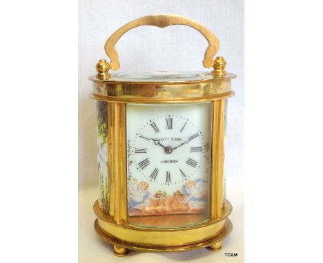 An Elliot and son carriage clock with enamel panelling