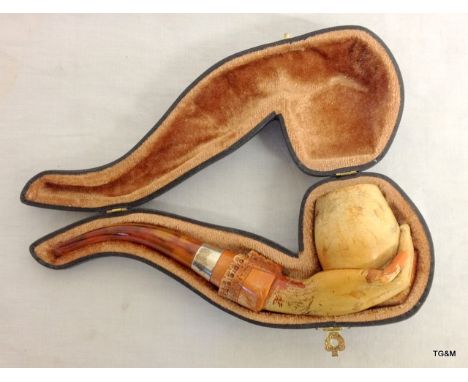 A meerschaum pipe with amber holder in original case