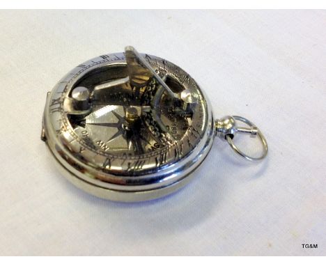 A pocket compass and sun dial