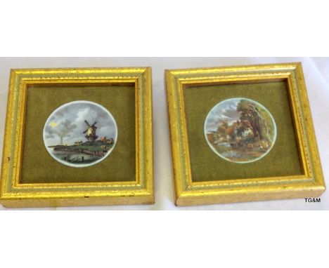 A pair of small enamel pictures in gilt frames