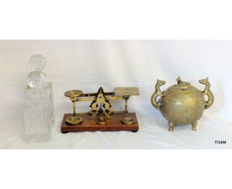 A pair of cut glass decanters, a set of postal scales with weights and an Oriental brass incense burner.