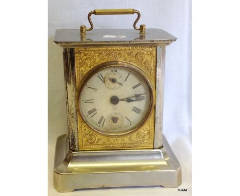 A  silver and gilt chiming God save the King carriage clock with key 