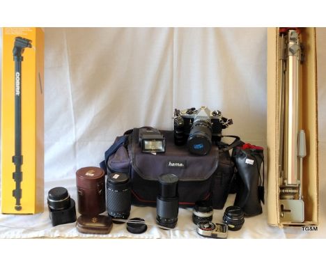 A Pentax ME super SLR with assorted Telephoto lens, tripod, carry case etc